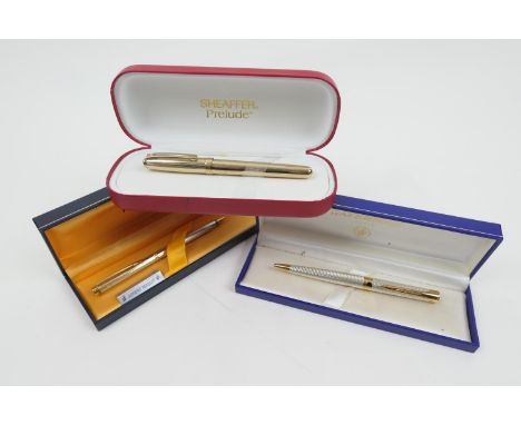 Shaeffer Prelude gold plated fountain pen, with box, papers and two cartridges; also Waterman, Paris, two silver and gold pla