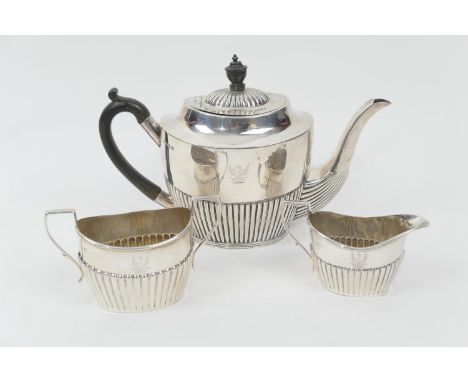 Composite three piece silver tea service, in Regency style comprising teapot by Mappin &amp; Webb, Sheffield 1902, of half re