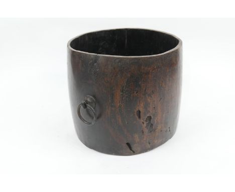 Far Eastern hardwood pail, 18th or 19th Century, slightly curved cylinder form with metal ring handles, height 26cm, 28.5cm d