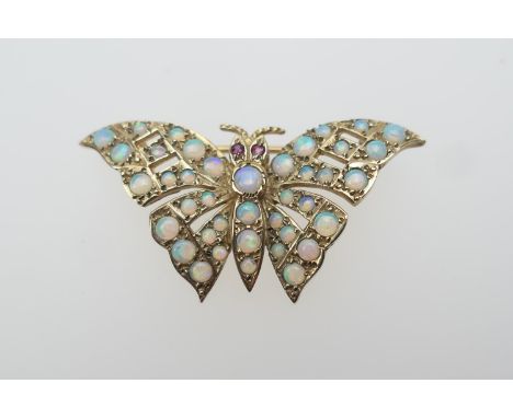 9ct gold and opal butterfly brooch, with ruby eyes, set with cabochon stones throughout, fully hallmarked, 40mm, gross weight