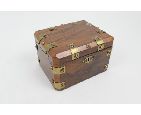 Rosewood and brass mounted tea caddy, canted rectangular form with brass strap embellishment, the interior with a cover, 14.5