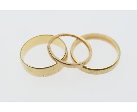 18ct gold plain polished wedding ring, size S, weight approx. 6.2g; also another 18ct gold polished wedding ring, size V/W, w