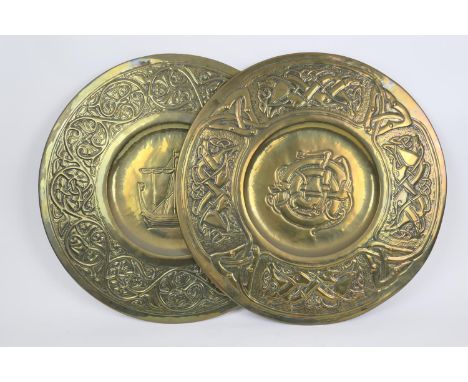 Two hand worked brass plaques, in the Newlyn style, one centred with a Viking style sailing boat bordered with Celtic inspire