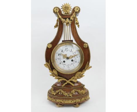 French walnut and ormolu lyre shaped mantel clock, white enamelled dial with Arabic numerals, the movement signed 'A D Mougin