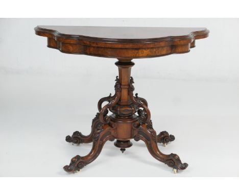 Victorian burr walnut folding pedestal card table, circa 1850, shaped top with well figured veneers swivelling open to a red 
