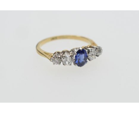 Sapphire and diamond five stone ring, centred with an oval cut sapphire of approx. 0.5ct flanked by old cushion cut diamonds,