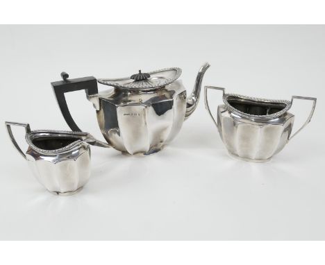 George V silver three piece tea service, maker FHA &amp; Co., Birmingham 1925/6, comprising lidded teapot, sugar basin and mi