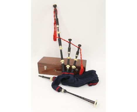 R G Lawrie, Glasgow, blackwood and celluloid bagpipes, circa 1930s, fully combed, original chanter, mounted with synthetic ba