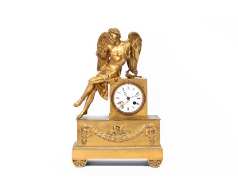 A French gilt bronze mantel clock with Apollo holding a rose, 19th C.H 41 - L 27 - D 10 cm  The work marked 'Grand medaille d