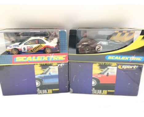 4 X Boxed Scalextric Cars. Including 2 Italian Job Minis. A Subaru Impreza and a Ford GT MK II.