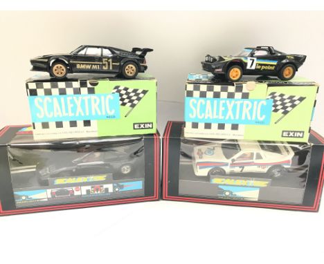 4 X Boxed Scalextric Cars including a Spanish BMW M1. A Spanish Lancia S. Le Point. A Martini Lancia and a Ferrari F40.