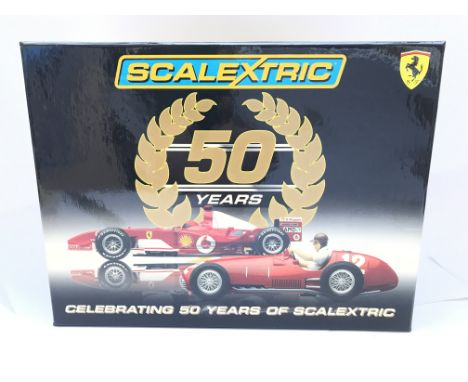 A Boxed Scalextric 50 Years of Scalextric Ferrari Set complete With Book.