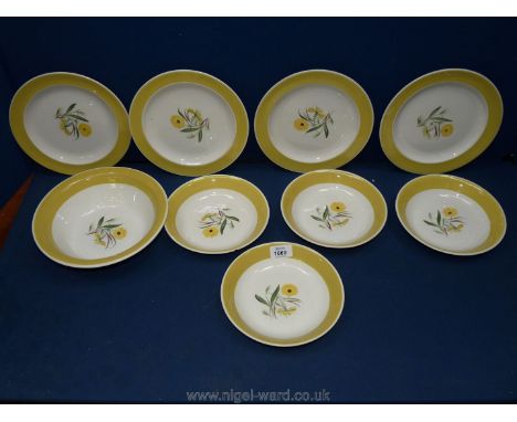 A quantity of Susie Cooper 'Marigold' tableware including four breakfast plates, four bowls and a serving bowl (some as found