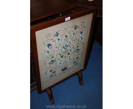 An Oak framed embroidered Firescreen