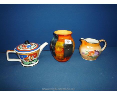 A Poole Pottery Vase with slight chip, a Sadler's Teapot and an orange blush Jug with floral decoration