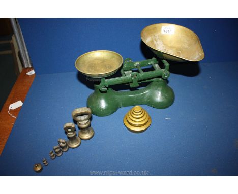 A set of old fashioned Weighing Scales with two sets of brass weights