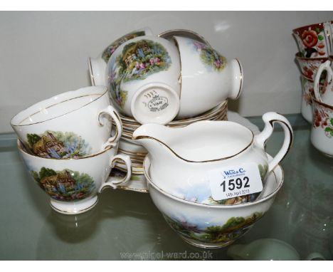 A six setting Royal Vale Cottage Teaset including six cups, saucers and plates, sucrier, milk jug and bread and butter plate