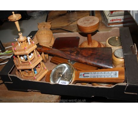 A box of treen including tie press, barometer, gun stock, etc