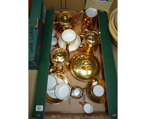 A quantity of Royal Worcester gold lustre china including Coffee Pot, Teapot, bowls, coffee cans, saucers, etc.