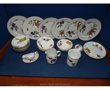 A quantity of Royal Worcester Evesham including six dinner plates, six cereal bowls, sauce boat and saucer, jug, utensil pot,