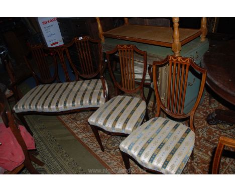 An Edwardian Mahogany Salon Suite comprising two seater sofa, four dining chairs and elbow chair, inlaid and strung throughou