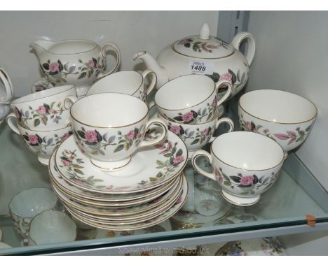 A Wedgwood 'Hathaway Rose' part Teaset including teapot (as found), milk jug, sugar bowl, eight cups, eight saucers and seven