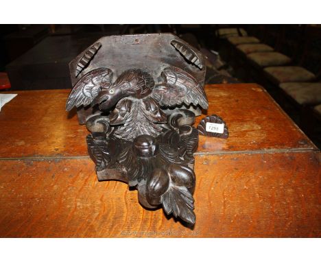 A heavily carved wooden Wall Bracket.
