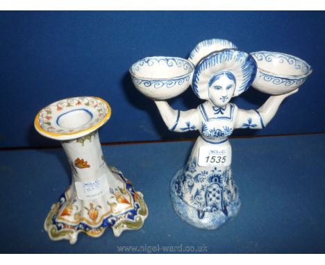 A French Faience Candlestick decorated in blue and rust with flowers, 5" tall probably early 19th century (as found to base) 