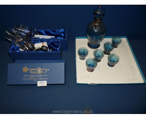 A small blue and gilt Oriental designed Carafe and six glasses together with two boxed champagne flutes given to ticket holde