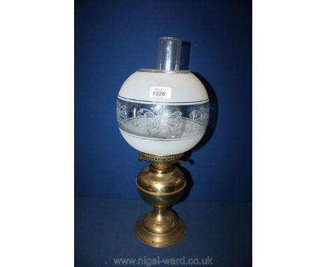 A brass based Lamp with embossed white glass shade
