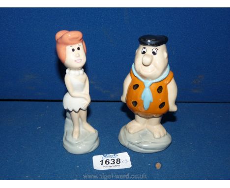 A pair of Wade ceramic Flintstones figurine 'Wilma' no. 0938/1500 and 'Fred' 0940/1500, 5" tall