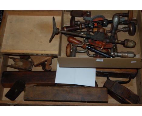 A mid-20th century pine tool trunk and contents to include moulding planes, hand drills, braces etc 