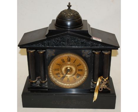 A circa 1900 black slate mantel clock of architectural form having a gilt dial with Roman numerals and eight day movement str