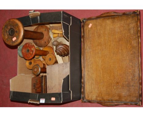 An early 20th century oak gallery tray; together with various treen bobbin stands, haberdashery tools etc 