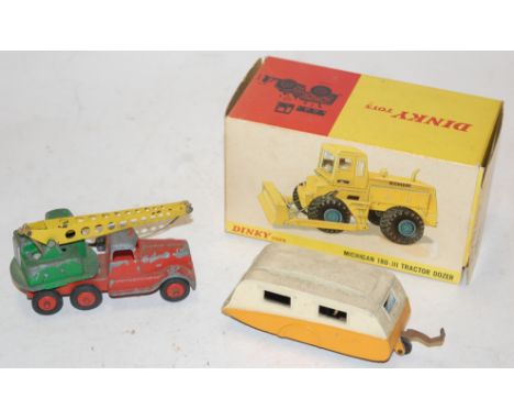A boxed Dinky toy Michigan 180-111 tractor dozer number 976 together with a Dinky Toys caravan 190, and a Crescent diecast tr