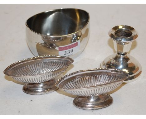 An early 20th century silver sugar bowl of plain oval form; together with a pair of Edwardian silver open salts; and a dwarf 