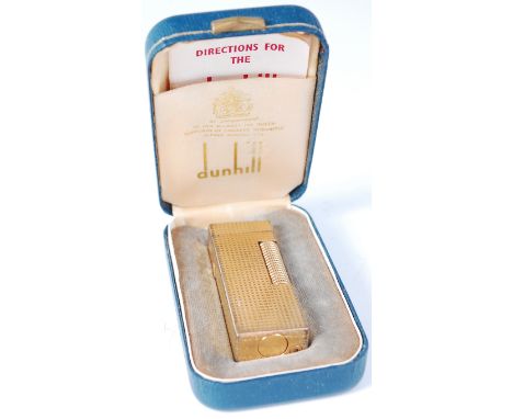 A cased Dunhill pocket cigarette lighter 