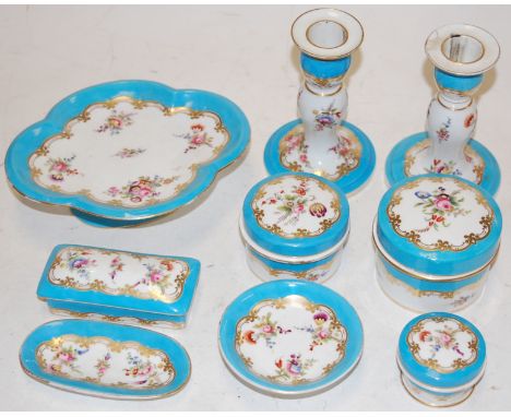 A Victorian porcelain part dressing table set, to include; trinket jars and stoppers, candlesticks etc (probably Minton)