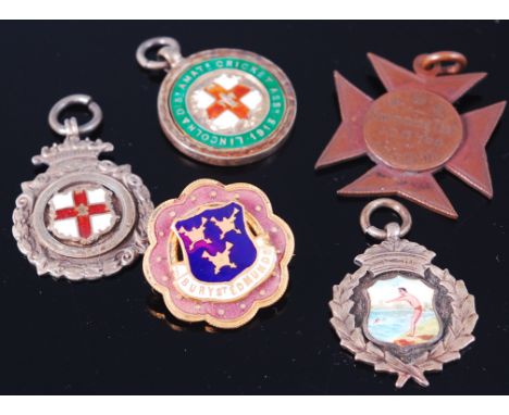 A silver and enamel sporting medal; and four others (5)