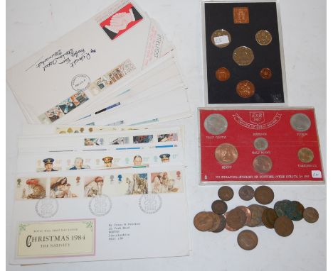 A large collection of assorted loose stamps, first day covers, and commemorative coins etc