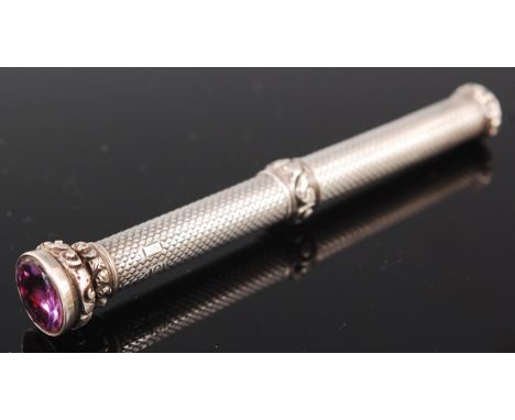 A silver propelling pencil, having amethyst set tip 