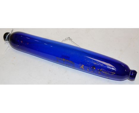 A late 19th century Bristol blue glass rolling pin with traces of gilt decoration