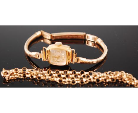 A ladies Stowa 9ct gold cased wristwatch, having manual wind movement, on gilt metal bracelet; together with a 9ct gold belch