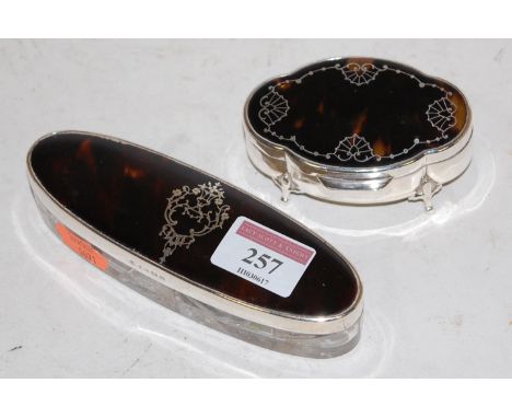 A George V silver and tortoiseshell trinket jar, of shaped oval form; together with one other silver mounted and tortoiseshel