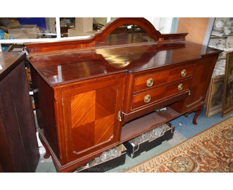 A late Victorian Mahogany Sideboard with dome top upstand having moulded edges and 'D' shaped mirror, the breakfront top havi