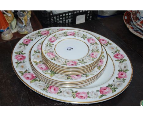 A Royal Worcester 'Royal Garden' part Dinner service including six  dinner and dessert plates and a large meat plate.