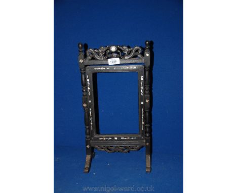 A dark wood Swivel Mirror Frame with Mother of Pearl inlay, no mirror.