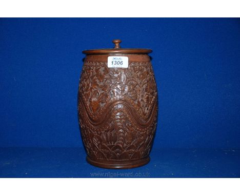 A Chinese Tea Caddy/humidor, well carved with animals, birds and hunters, etc. and having metal liner and cover, 9 3/4" high,