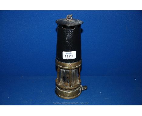 A very old flat wick Miner's Lamp