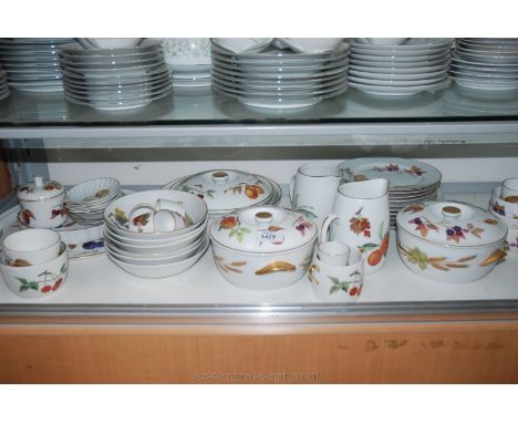 A quantity of Worcester Evesham tableware including lidded vegetable dishes, cake dish, etc.